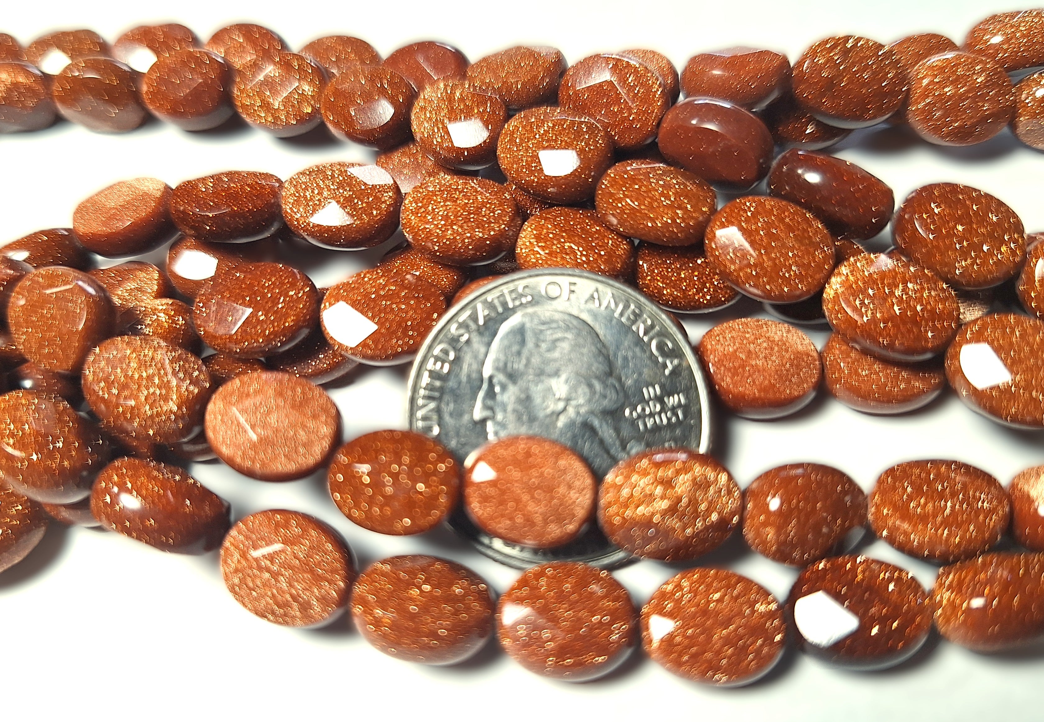10x8mm Goldstone Faceted Oval Gemstone Beads 16-Inch Strand