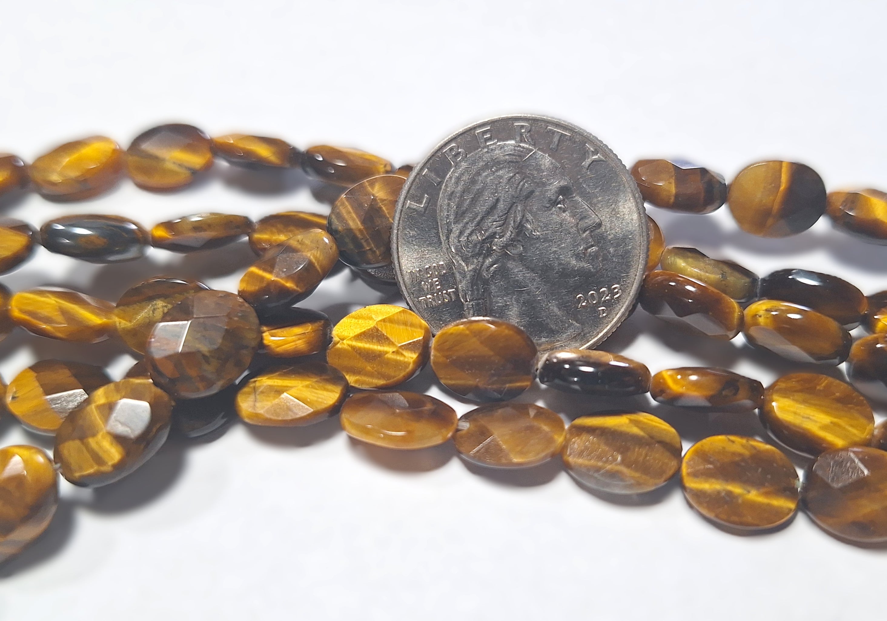 10x8mm Tiger's Eye Faceted Oval Gemstone Beads 16-Inch Strand